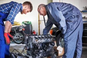 mechanics inspecting car engine